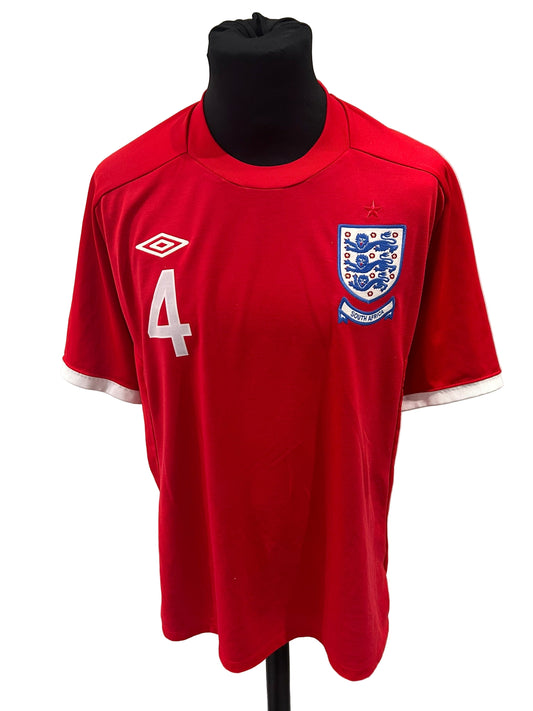 England 2010-11 away football shirt, red, medium, Umbro, Steven Gerrard, front